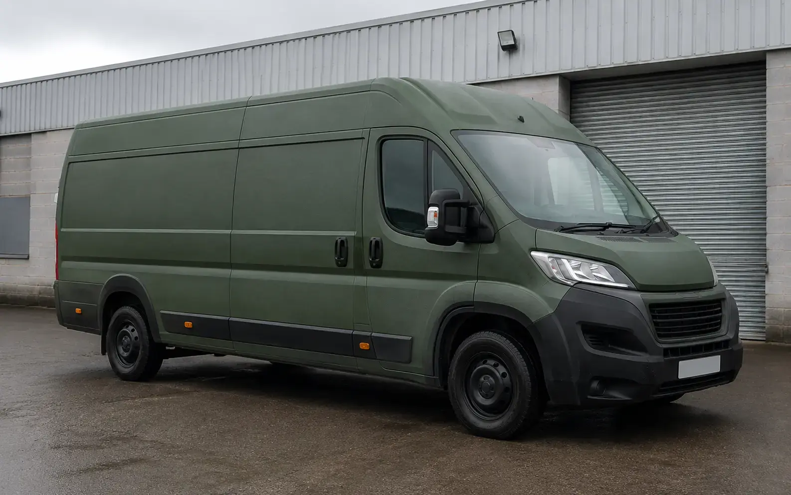 Complete long-wheelbase van finished in dark olive-green textured Raptor coating