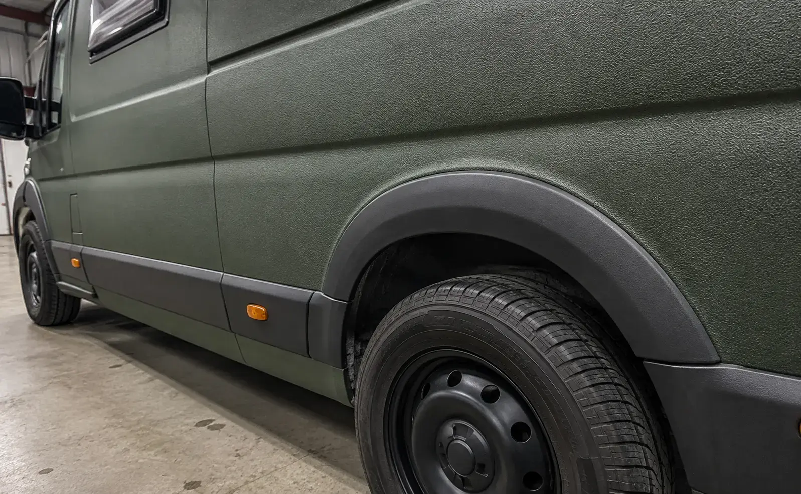 Textured Raptor coating on a campervan panel