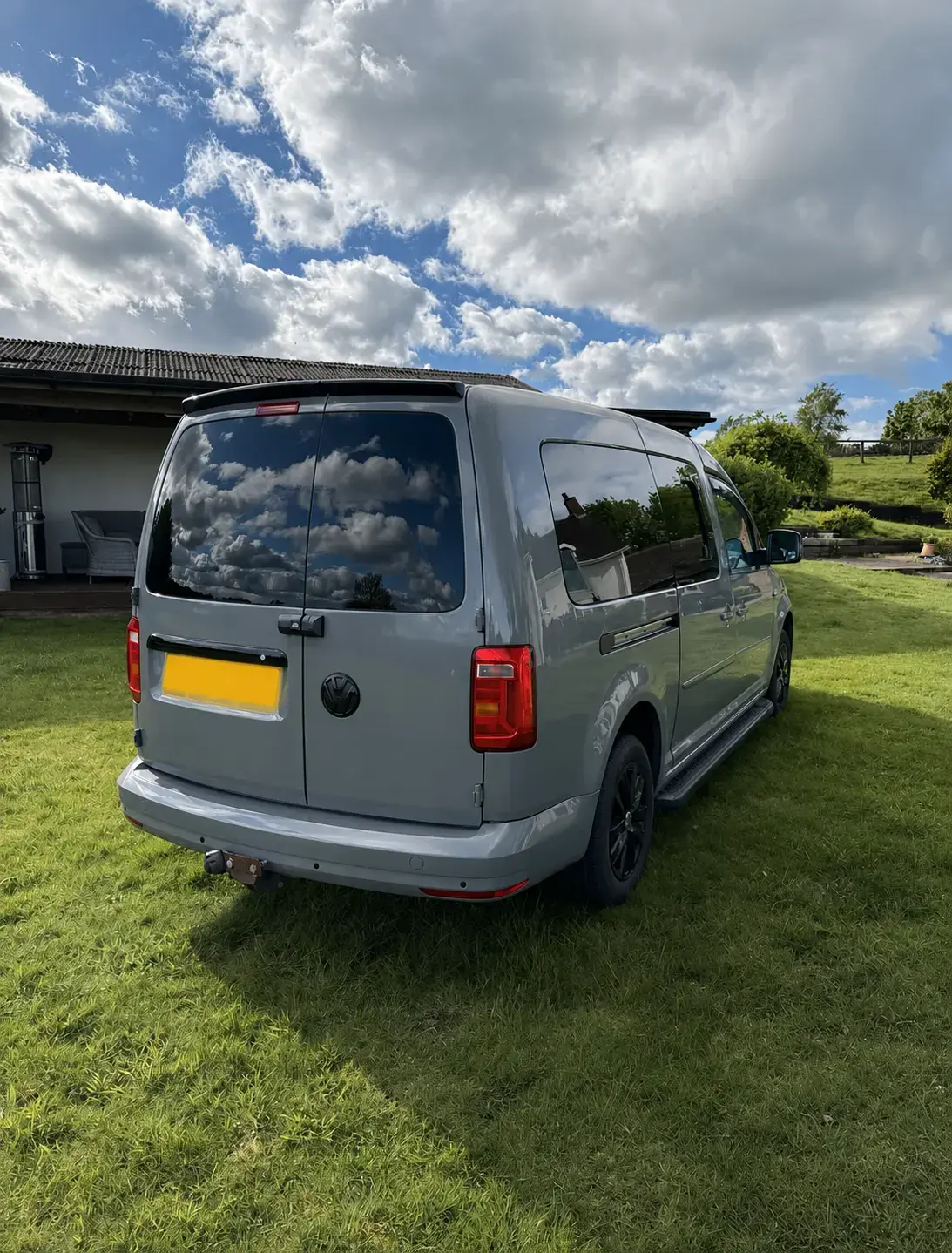 Rear view of the sold grey Volkswagen camper with its registration concealed for privacy